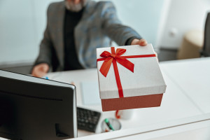 man demonstrating present gift at the table 2023 11 27 05 12 12 utc